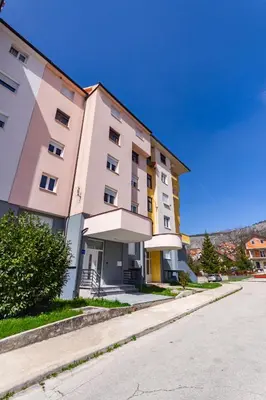 a large building on the side of a street at Apartman Krželj B3 in Livno