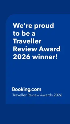 a blue sign that says were proud to be a traveller reviewagency winner at Villa Vista in Banja Luka