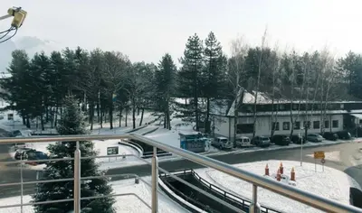a view of a street with snow on the ground at Apartman Oskar 1 in Kupres
