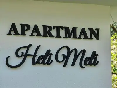 a sign for a manican half mall on a building at Apartman Heli Meli 1 in Jajce