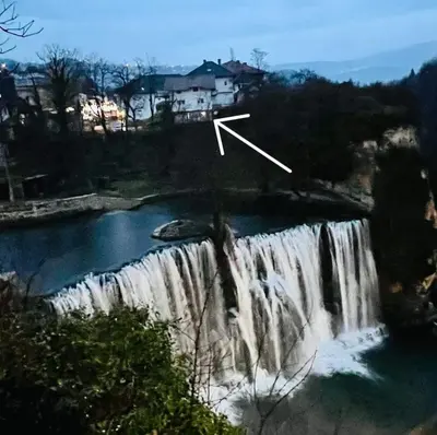 a picture of a waterfall with a x on it at Apartman Heli Meli 2 in Jajce