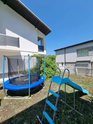 a playground with a slide and a trampoline at Apartmani CENTAR in Jajce