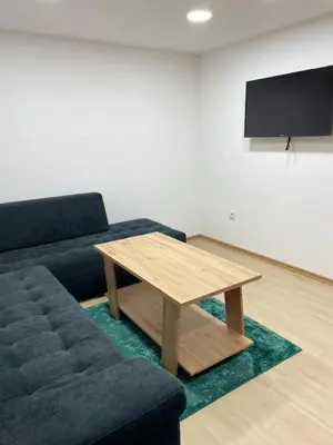 a living room with a couch and a table at Vila Flora Vlašić in Šišava