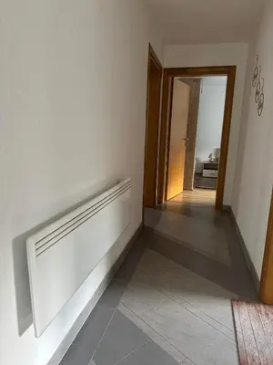 a room with a hallway with a door and a tile floor at Riverstone Retreat Villa in Jajce