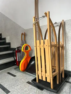 a set of wooden gates in a room with stairs at Montis Vlasic Apartment 1 in Vlasic