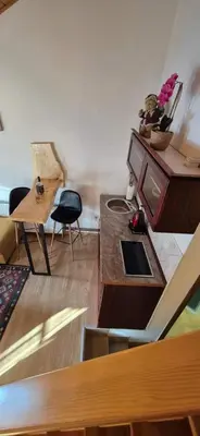 a living room with a tv and a table at Viktory II in Vlasic