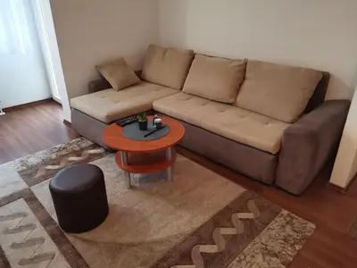 a living room with a couch and a table at Stan na dan Banja Luka in Banja Luka