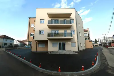 a building with orange cones around it on a street at Apartman Dentalux 3 in Banja Luka