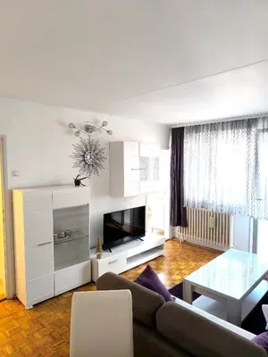 a living room with a couch and a table at Apartman Borik in Banja Luka