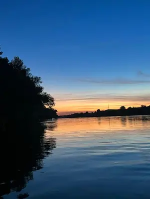 a view of a river at sunset at Apartmani Una Lux in Spilja