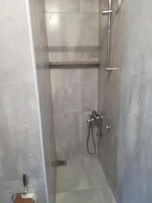 a bathroom with a shower with a toilet in it at stidio sa 1 spavaćom sobom SM IK 4 in Tomislavgrad