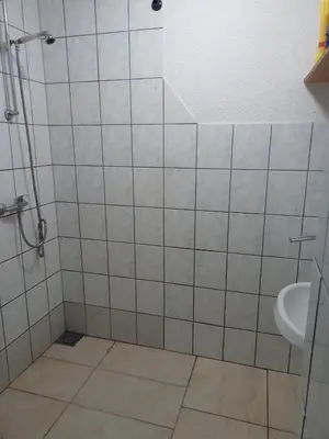 a bathroom with a shower and a sink at apartman SM IK 5 in Šujica