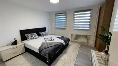 a bedroom with a bed with zebra pillows on it at HomeSpot Banja Luka in Banja Luka