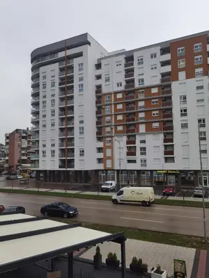 a view of a street with tall buildings and cars at Apartman Urban Rest in Doboj
