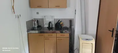 a kitchen with a sink and a counter top at Faris in Bihać