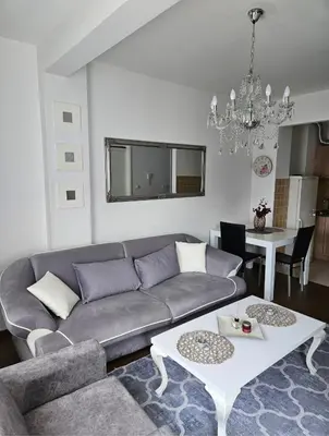 a living room with a couch and a table at Comfort pored Klinickog Centra in Banja Luka