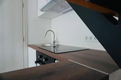 a kitchen with a sink and a counter top at HANA Superior Apartment in Kakanj