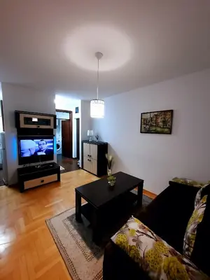 a living room with a couch and a flat screen tv at AnyBL01 in Banja Luka