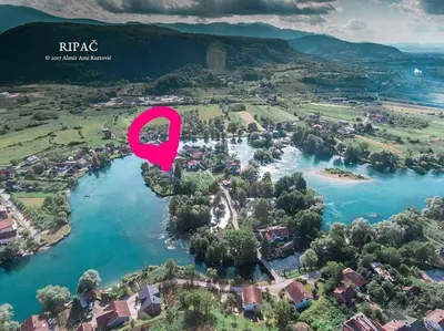 an aerial view of a river with a pink marker at Apartman UnaTesnim in Bihać