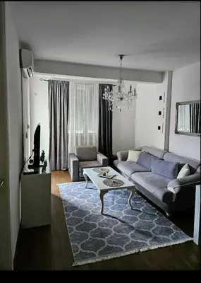 a living room with a couch and a table at Comfort u blizini Klinickog Centra Banja Luka in Lauš