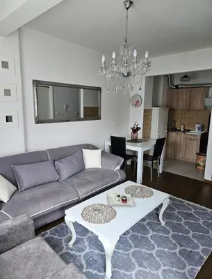 a living room with a couch and a table at Comfort u blizini Klinickog Centra Banja Luka in Lauš