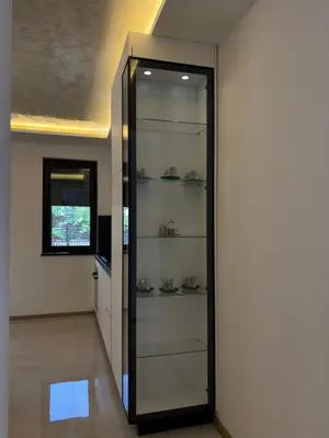 a room with a glass door with shelves at Villa Aurea in Bihać