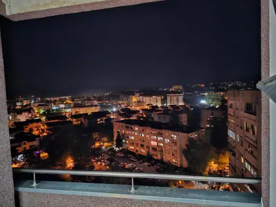 a view of a city at night from a window at Ramonda Banja Luka in Banja Luka