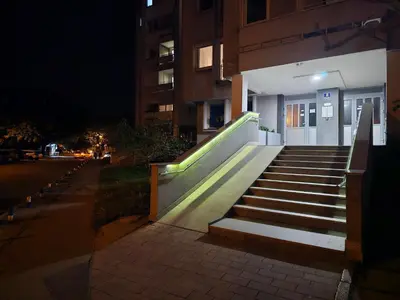 a set of stairs leading to a building at night at Ramonda Banja Luka in Banja Luka