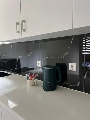 a kitchen counter with a trash can on a wall at Apartment Lana Vareš in Vareš