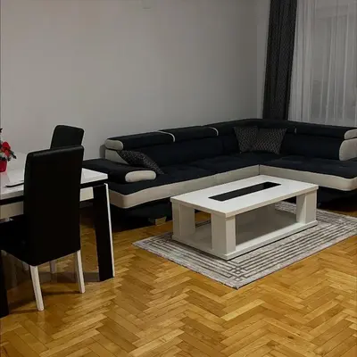 a living room with a couch and a table at Stan na dan Šamac in Bosanski Šamac