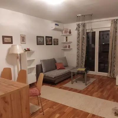 a living room with a couch and a table at Apartman Ella in Železnička Stanica Incel