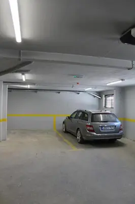 a silver car parked in a parking garage at VIP Apartment Visoko in Visoko
