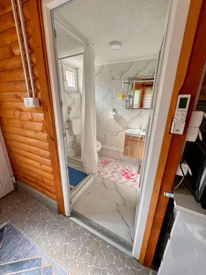 a glass door of a shower in a bathroom at Oaza mira Visoko in Visoko