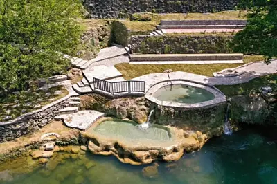 an aerial view of a pond with a fountain in the water at Riverside Panorama Apartment 1 near City Center Brko 1 in Banja Luka