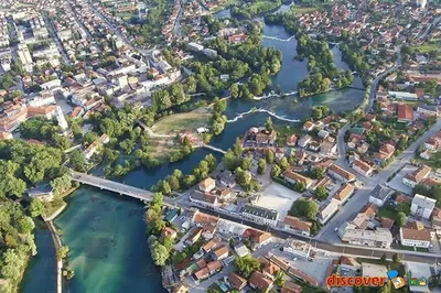 an aerial view of a city with a river at New World in Bihać