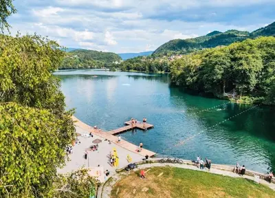 a view of a river with people on a bridge at Apartman D&D 2 in Jajce