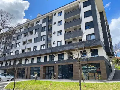 an apartment building on the corner of a street at Zeus Apartment in Banja Luka